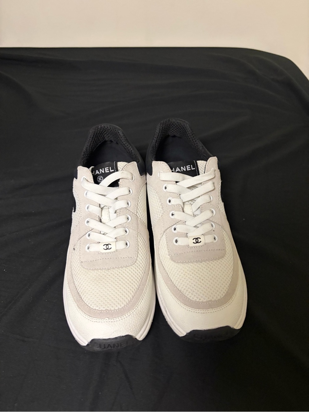 CHANEL Men’s White and Black Low-Top Sneakers